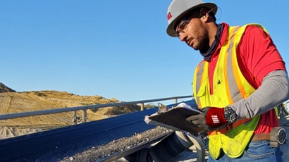 Motion Conveyance Solutions field services rep onsite wearing personal protective equipment (PPE)