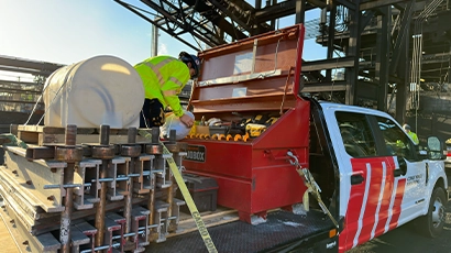 Motion Conveyance Solutions white and red repair truck on location