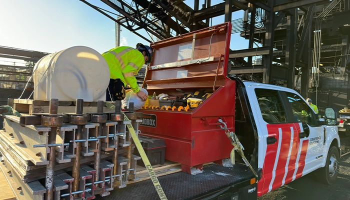 Motion Conveyance heavyweight belting technician wearing personal protective equipment on site