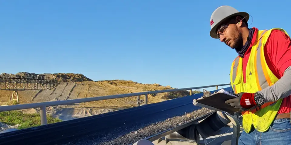 Motion Conveyance Solutions field service worker with hardhat
