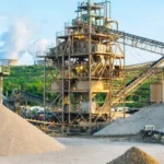 Exterior view of open cast mine with blue sky background