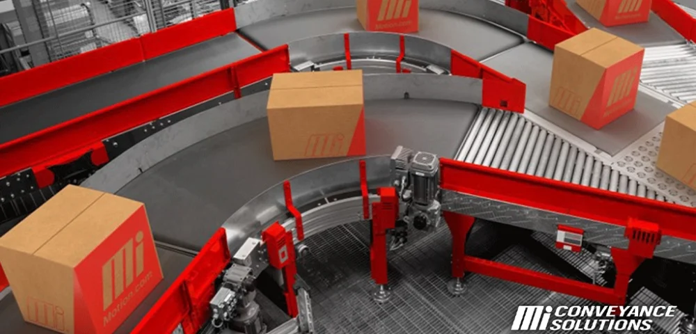 Conveyor belt curve showing brown packed Mi Motion boxes