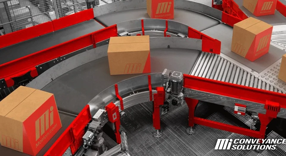 Conveyor belt curve showing brown packed Mi Motion boxes
