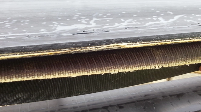 Close-up image of conveyor belts, showing pulley width