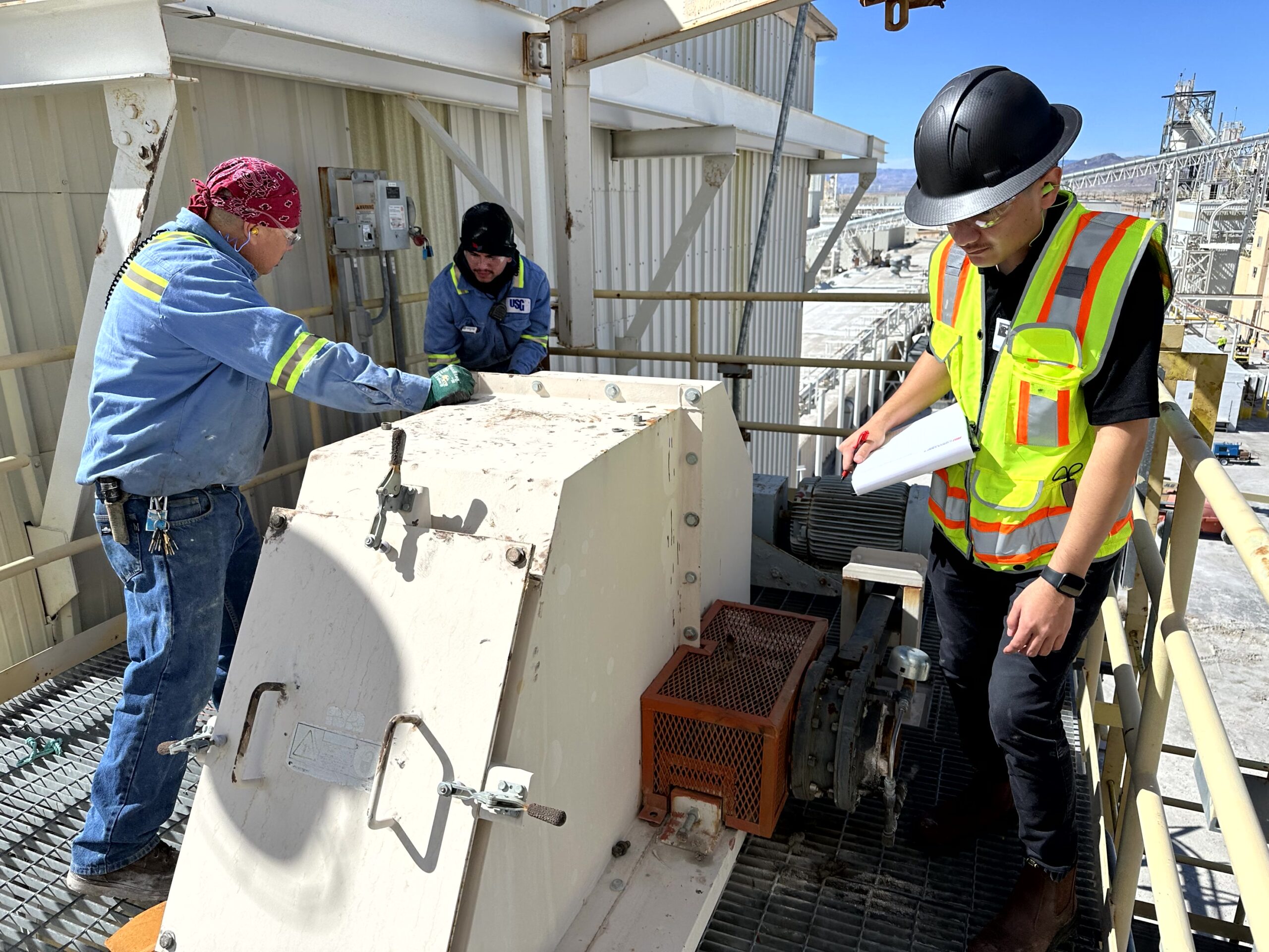 Employees working on a conveyor engineering job site